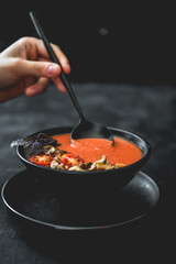 Tasty tomato soup. Fresh cream soup.Organic meal. Vegan food. Mediterranean cuisine. Dish in bowl.  