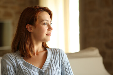 Confident tenant looking at side at home