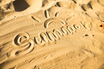 The Word Summer Written in the Sand