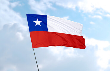 Fototapeta na wymiar Flag of Chile, realistic 3d rendering in front of blue sky