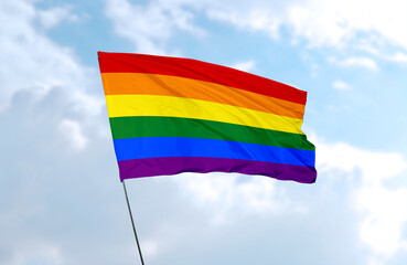 LGBT Flag, realistic 3d rendering in front of blue sky