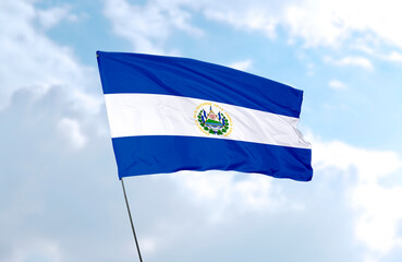 Flag of El Salvador, realistic 3d rendering in front of blue sky