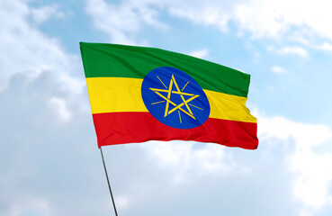 Flag of Ethiopia, realistic 3d rendering in front of blue sky