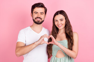 Photo of nice young brown hair couple show heart wear white t-shirt dress isolated on pink color backgound