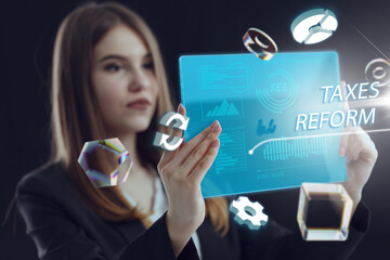 Business, Technology, Internet and network concept. Young businessman working on a virtual screen of the future and sees the inscription: Taxes reform