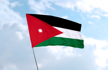 Flag of Jordan, realistic 3d rendering in front of blue sky