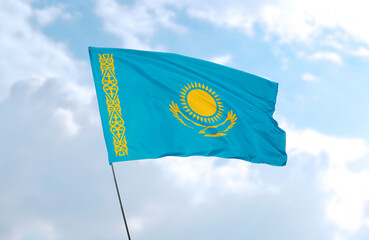Flag of Kazahstan, realistic 3d rendering in front of blue sky