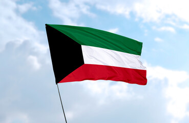 Flag of Kuwait, realistic 3d rendering in front of blue sky