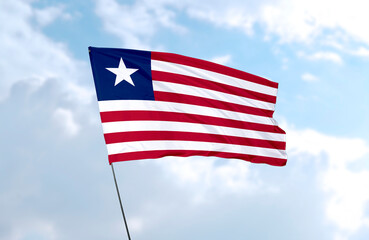 Flag of Liberia, realistic 3d rendering in front of blue sky