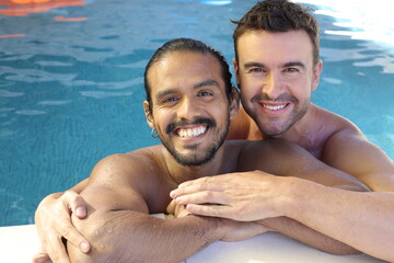 Gorgeous interracial gay couple in swimming pool 