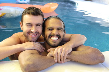 Gorgeous interracial gay couple in swimming pool 