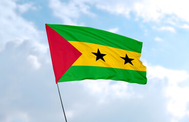 Flag of Sao Tome and Principe, realistic 3d rendering in front of blue sky