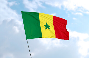 Flag of Senegal, realistic 3d rendering in front of blue sky