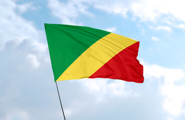 Flag of the Republic of the Congo, realistic 3d rendering in front of blue sky