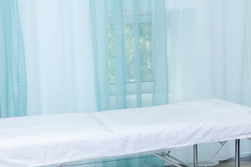 office interior in a health facility with exam table