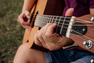 Fototapeta na wymiar girl playing guitar, learning guitar