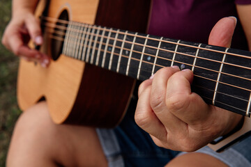 Fototapeta na wymiar girl playing guitar, learning guitar
