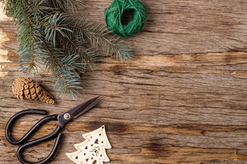 A bouquet of fir branches on an old wooden background.