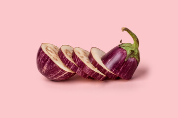 Sliced eggplant on a peach background