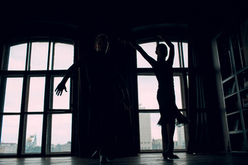 Young couple boy and girl dancing in ballroom dance Rumba.