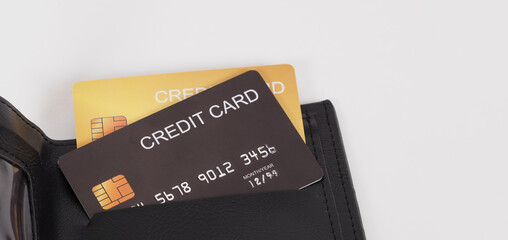 Close up of credit card Black and gold color in black in wallet isolated on white background..