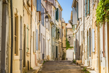 View of a street in Arles old town in summer. Provence, France.
