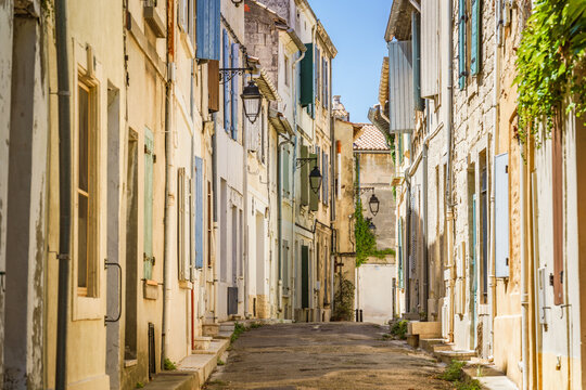 Fototapeta View of a street in Arles old town in summer. Provence, France.
