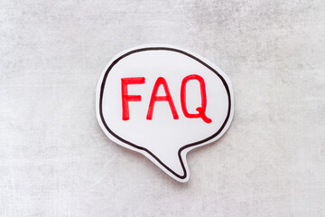 Concept of faq word on paper bubble. Frequently asked questions concept