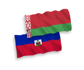 Fototapeta premium National vector fabric wave flags of Republic of Haiti and Belarus isolated on white background. 1 to 2 proportion.