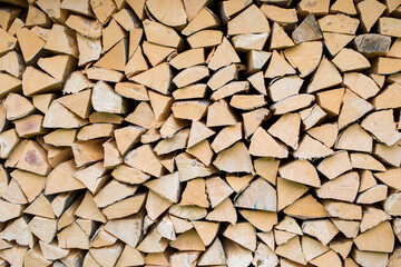 Pile of wood forming a wall. Ecology and deforestation problems in nature.