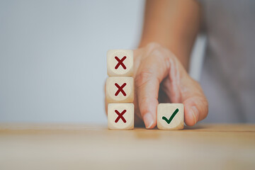 senior business woman selected correct icon on wooden cube from her experience for business, make a...