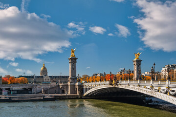 Paris France, city skyline at Seine River Pont Alexandre III bridge and Esplanade des Invalides with autumn foliage season