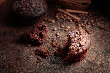 Chocolate muffins on a brown background.
