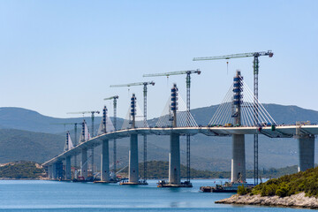 Construction of road bridge across sea channel connecting Croatian mainland with Peljsac peninsula.