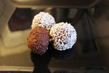 chocolate sweets on black background 