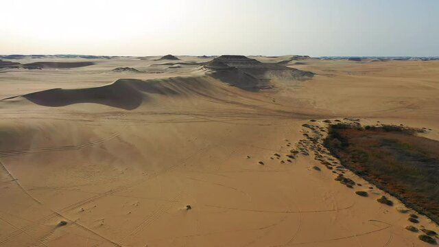 Aerial Forward Scenic View Of Desert Against Clear Sky On Sunny Day - Siwa Oasis, Egypt