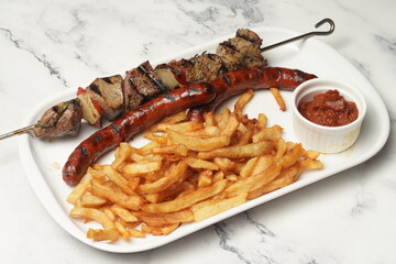 Kebab and sausage with fries