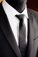 Men model - dummy. Dark gray men's evening dress, blazer, white shirt, tie.