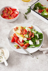 romaine lettuce topped with bacon tomato parmesan, sauce. healthy keto paleo diet lunch