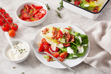 romaine lettuce topped with bacon tomato parmesan, sauce. healthy keto paleo diet lunch