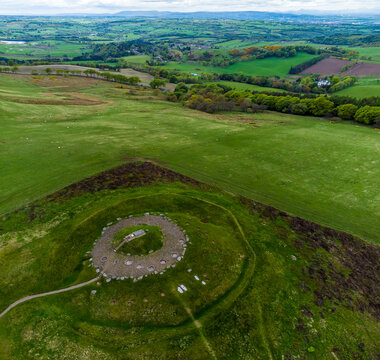 An aerial view over the Cairnpapple Hill burial site in Scotland on a summers day