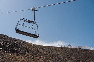 Lift lines in the ski resort of sierra nevada in granada. Ski lifts for winter sports in the mountains. horizontal photography. - obrazy, fototapety, plakaty
