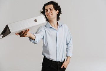 Smiling young brunette man in white smart shirt