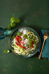 keto paleo zoodles bolognese: zucchini noodles with meat sauce and parmesan