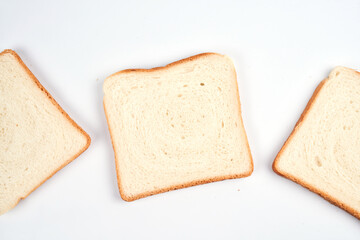 Square slices of toast sandwich bread isolated on white background close up