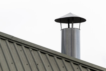 Stainless steel chimney on the roof.