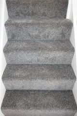 Newly renovated staircase with fresh paint and new grey carpets - ready for sale or rental on the UK market.