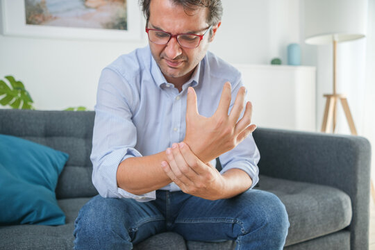 Painful wrist injury symptom after sitting on the sofa