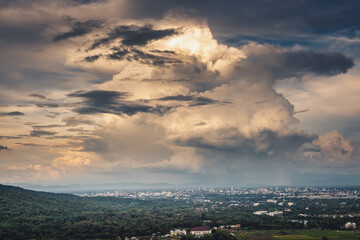 Fototapeta na wymiar Landscape of Dramatic Cloudy Sky Over The City at Chiang Mai of Thailand, Stormy Atmosphere Weather Situation With Dramatic Clouds Sky at Evening Sunset. Natural Cloud Sky background.