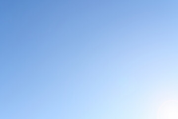 Blue sky with sunlight. The natural background is blue.